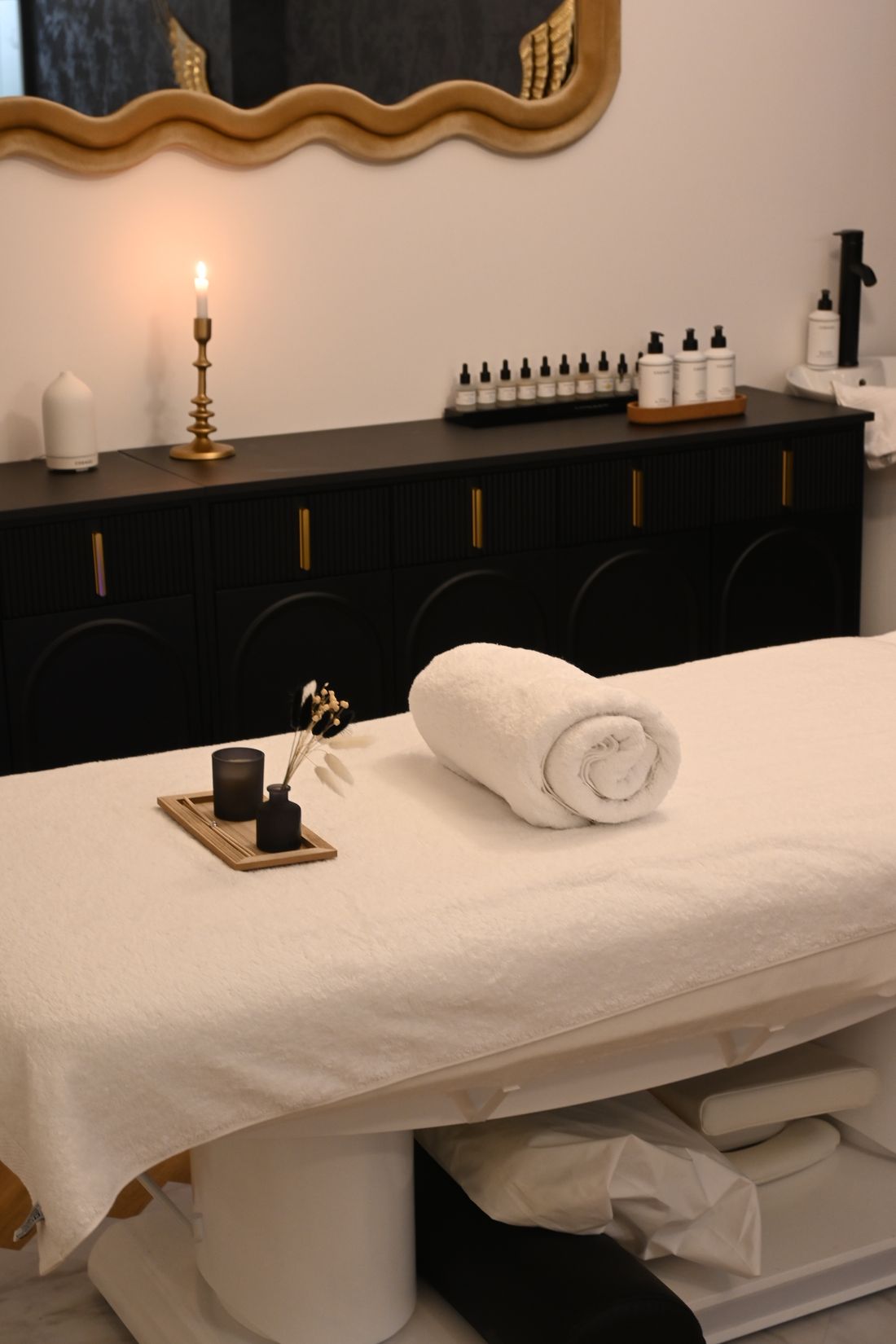 Calm, private treatment room at Dr Jolie, prepared with fresh towels and skincare products