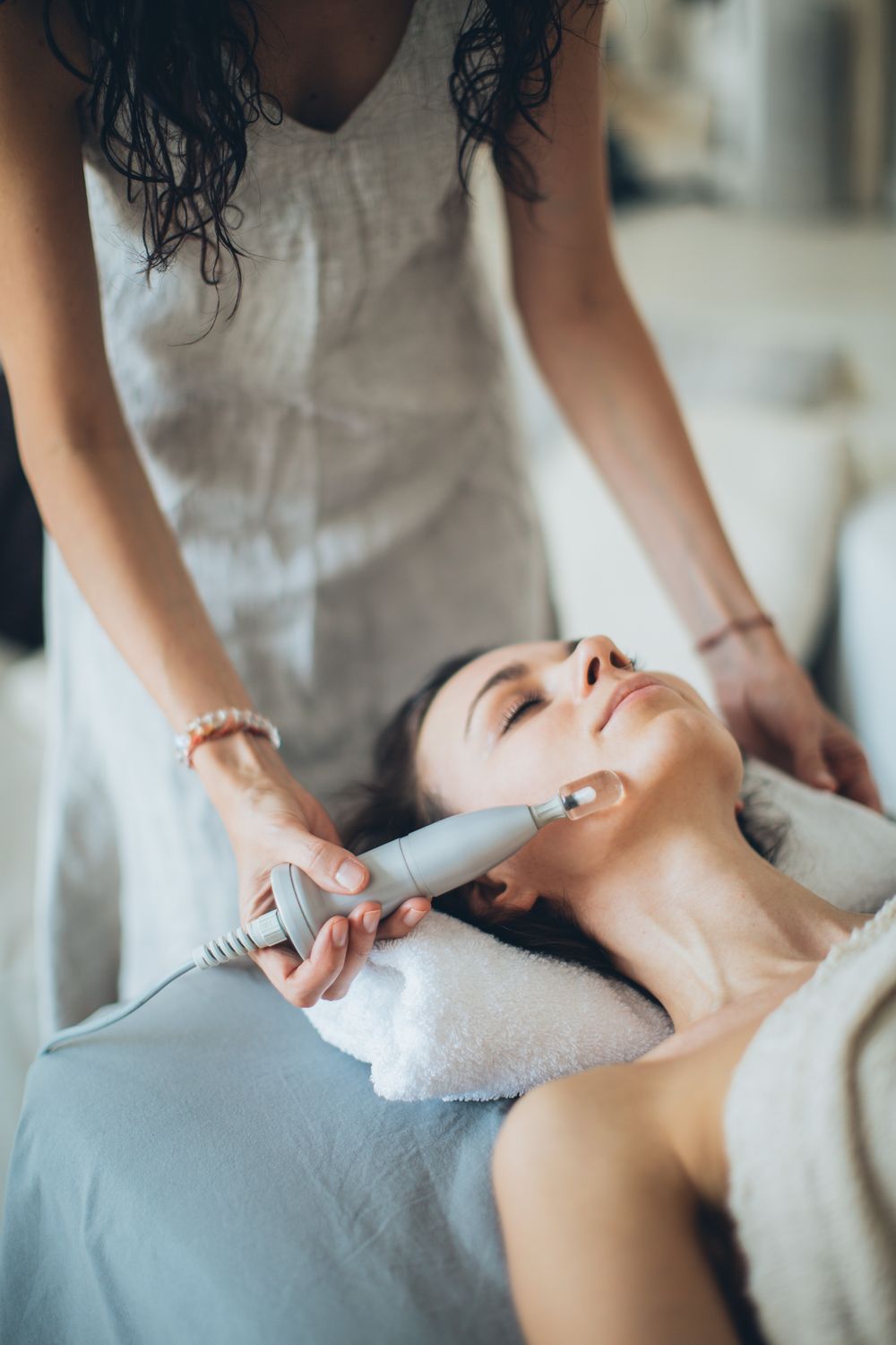 Client receiving a gentle facial skin treatment at Dr Jolie